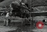 Image of USAAC mechanics perform maintenance on P-40 and P-400 airplanes Guadalcanal Solomon Islands, 1943, second 4 stock footage video 65675074690