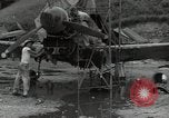Image of USAAC mechanics perform maintenance on P-40 and P-400 airplanes Guadalcanal Solomon Islands, 1943, second 7 stock footage video 65675074690