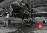 Image of USAAC mechanics perform maintenance on P-40 and P-400 airplanes Guadalcanal Solomon Islands, 1943, second 8 stock footage video 65675074690