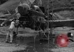 Image of USAAC mechanics perform maintenance on P-40 and P-400 airplanes Guadalcanal Solomon Islands, 1943, second 9 stock footage video 65675074690