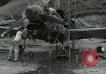 Image of USAAC mechanics perform maintenance on P-40 and P-400 airplanes Guadalcanal Solomon Islands, 1943, second 10 stock footage video 65675074690