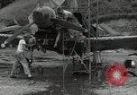 Image of USAAC mechanics perform maintenance on P-40 and P-400 airplanes Guadalcanal Solomon Islands, 1943, second 12 stock footage video 65675074690