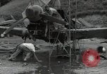 Image of USAAC mechanics perform maintenance on P-40 and P-400 airplanes Guadalcanal Solomon Islands, 1943, second 13 stock footage video 65675074690