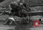 Image of USAAC mechanics perform maintenance on P-40 and P-400 airplanes Guadalcanal Solomon Islands, 1943, second 14 stock footage video 65675074690