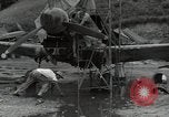 Image of USAAC mechanics perform maintenance on P-40 and P-400 airplanes Guadalcanal Solomon Islands, 1943, second 15 stock footage video 65675074690