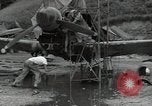 Image of USAAC mechanics perform maintenance on P-40 and P-400 airplanes Guadalcanal Solomon Islands, 1943, second 16 stock footage video 65675074690