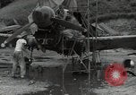 Image of USAAC mechanics perform maintenance on P-40 and P-400 airplanes Guadalcanal Solomon Islands, 1943, second 18 stock footage video 65675074690