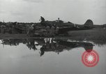 Image of USAAC mechanics perform maintenance on P-40 and P-400 airplanes Guadalcanal Solomon Islands, 1943, second 44 stock footage video 65675074690