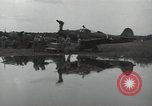 Image of USAAC mechanics perform maintenance on P-40 and P-400 airplanes Guadalcanal Solomon Islands, 1943, second 46 stock footage video 65675074690