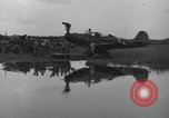 Image of USAAC mechanics perform maintenance on P-40 and P-400 airplanes Guadalcanal Solomon Islands, 1943, second 50 stock footage video 65675074690