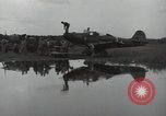 Image of USAAC mechanics perform maintenance on P-40 and P-400 airplanes Guadalcanal Solomon Islands, 1943, second 51 stock footage video 65675074690