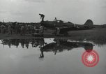Image of USAAC mechanics perform maintenance on P-40 and P-400 airplanes Guadalcanal Solomon Islands, 1943, second 52 stock footage video 65675074690