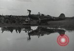 Image of USAAC mechanics perform maintenance on P-40 and P-400 airplanes Guadalcanal Solomon Islands, 1943, second 53 stock footage video 65675074690