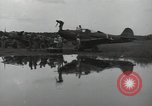 Image of USAAC mechanics perform maintenance on P-40 and P-400 airplanes Guadalcanal Solomon Islands, 1943, second 54 stock footage video 65675074690