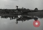 Image of USAAC mechanics perform maintenance on P-40 and P-400 airplanes Guadalcanal Solomon Islands, 1943, second 55 stock footage video 65675074690