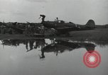 Image of USAAC mechanics perform maintenance on P-40 and P-400 airplanes Guadalcanal Solomon Islands, 1943, second 56 stock footage video 65675074690