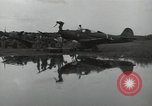 Image of USAAC mechanics perform maintenance on P-40 and P-400 airplanes Guadalcanal Solomon Islands, 1943, second 57 stock footage video 65675074690