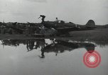 Image of USAAC mechanics perform maintenance on P-40 and P-400 airplanes Guadalcanal Solomon Islands, 1943, second 58 stock footage video 65675074690