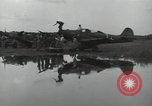 Image of USAAC mechanics perform maintenance on P-40 and P-400 airplanes Guadalcanal Solomon Islands, 1943, second 59 stock footage video 65675074690