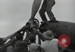 Image of USAAC mechanics perform maintenance on P-40 and P-400 airplanes Guadalcanal Solomon Islands, 1943, second 61 stock footage video 65675074690
