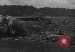 Image of Wrecked P-38 Lightening aircraft Guadalcanal Solomon Islands, 1943, second 48 stock footage video 65675074697