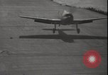 Image of planes on deck Pacific Ocean, 1945, second 32 stock footage video 65675074717