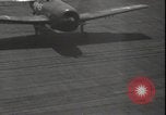 Image of planes on deck Pacific Ocean, 1945, second 33 stock footage video 65675074717