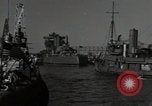 Image of tug boats moving the USS West Virginia after initial repairs in Pearl  Oahu Hawaii USA, 1942, second 4 stock footage video 65675074763