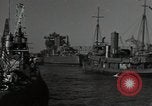 Image of tug boats moving the USS West Virginia after initial repairs in Pearl  Oahu Hawaii USA, 1942, second 17 stock footage video 65675074763