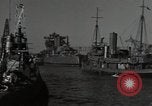 Image of tug boats moving the USS West Virginia after initial repairs in Pearl  Oahu Hawaii USA, 1942, second 18 stock footage video 65675074763
