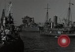Image of tug boats moving the USS West Virginia after initial repairs in Pearl  Oahu Hawaii USA, 1942, second 19 stock footage video 65675074763