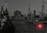 Image of tug boats moving the USS West Virginia after initial repairs in Pearl  Oahu Hawaii USA, 1942, second 20 stock footage video 65675074763