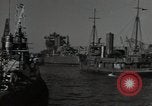 Image of tug boats moving the USS West Virginia after initial repairs in Pearl  Oahu Hawaii USA, 1942, second 21 stock footage video 65675074763