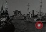 Image of tug boats moving the USS West Virginia after initial repairs in Pearl  Oahu Hawaii USA, 1942, second 22 stock footage video 65675074763