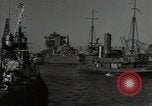 Image of tug boats moving the USS West Virginia after initial repairs in Pearl  Oahu Hawaii USA, 1942, second 23 stock footage video 65675074763