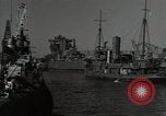 Image of tug boats moving the USS West Virginia after initial repairs in Pearl  Oahu Hawaii USA, 1942, second 24 stock footage video 65675074763