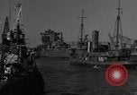 Image of tug boats moving the USS West Virginia after initial repairs in Pearl  Oahu Hawaii USA, 1942, second 25 stock footage video 65675074763