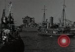 Image of tug boats moving the USS West Virginia after initial repairs in Pearl  Oahu Hawaii USA, 1942, second 27 stock footage video 65675074763