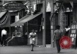 Standbild Harlem street scene in 1939 New York City USA, 1939, aus Sekunde 46 historischem Filmmaterial Videoclip 65675074863