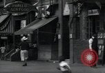 Standbild Harlem street scene in 1939 New York City USA, 1939, aus Sekunde 56 historischem Filmmaterial Videoclip 65675074863