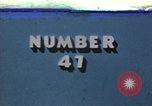 Image of strafing Japanese warehouses Pacific Theater, 1944, second 1 stock footage video 65675074901