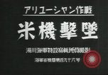 Standbild japanische Kriegsschiffe Brand bei uns Flugzeuge über Insel Kiska Aleutians, 1942, aus Sekunde 4 historischem Filmmaterial Videoclip 65675075195