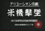 Standbild japanische Kriegsschiffe Brand bei uns Flugzeuge über Insel Kiska Aleutians, 1942, aus Sekunde 11 historischem Filmmaterial Videoclip 65675075195