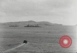 Standbild japanische Kriegsschiffe Brand bei uns Flugzeuge über Insel Kiska Aleutians, 1942, aus Sekunde 12 historischem Filmmaterial Videoclip 65675075195
