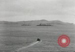 Standbild japanische Kriegsschiffe Brand bei uns Flugzeuge über Insel Kiska Aleutians, 1942, aus Sekunde 14 historischem Filmmaterial Videoclip 65675075195