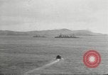Standbild japanische Kriegsschiffe Brand bei uns Flugzeuge über Insel Kiska Aleutians, 1942, aus Sekunde 16 historischem Filmmaterial Videoclip 65675075195