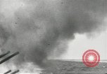 Standbild japanische Kriegsschiffe Brand bei uns Flugzeuge über Insel Kiska Aleutians, 1942, aus Sekunde 17 historischem Filmmaterial Videoclip 65675075195