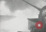 Standbild japanische Kriegsschiffe Brand bei uns Flugzeuge über Insel Kiska Aleutians, 1942, aus Sekunde 19 historischem Filmmaterial Videoclip 65675075195