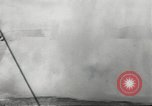 Standbild japanische Kriegsschiffe Brand bei uns Flugzeuge über Insel Kiska Aleutians, 1942, aus Sekunde 34 historischem Filmmaterial Videoclip 65675075195