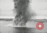 Standbild japanische Kriegsschiffe Brand bei uns Flugzeuge über Insel Kiska Aleutians, 1942, aus Sekunde 35 historischem Filmmaterial Videoclip 65675075195
